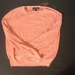 I'm selling this because my daughter doesn't fit in it ,its a pink sweater kind.